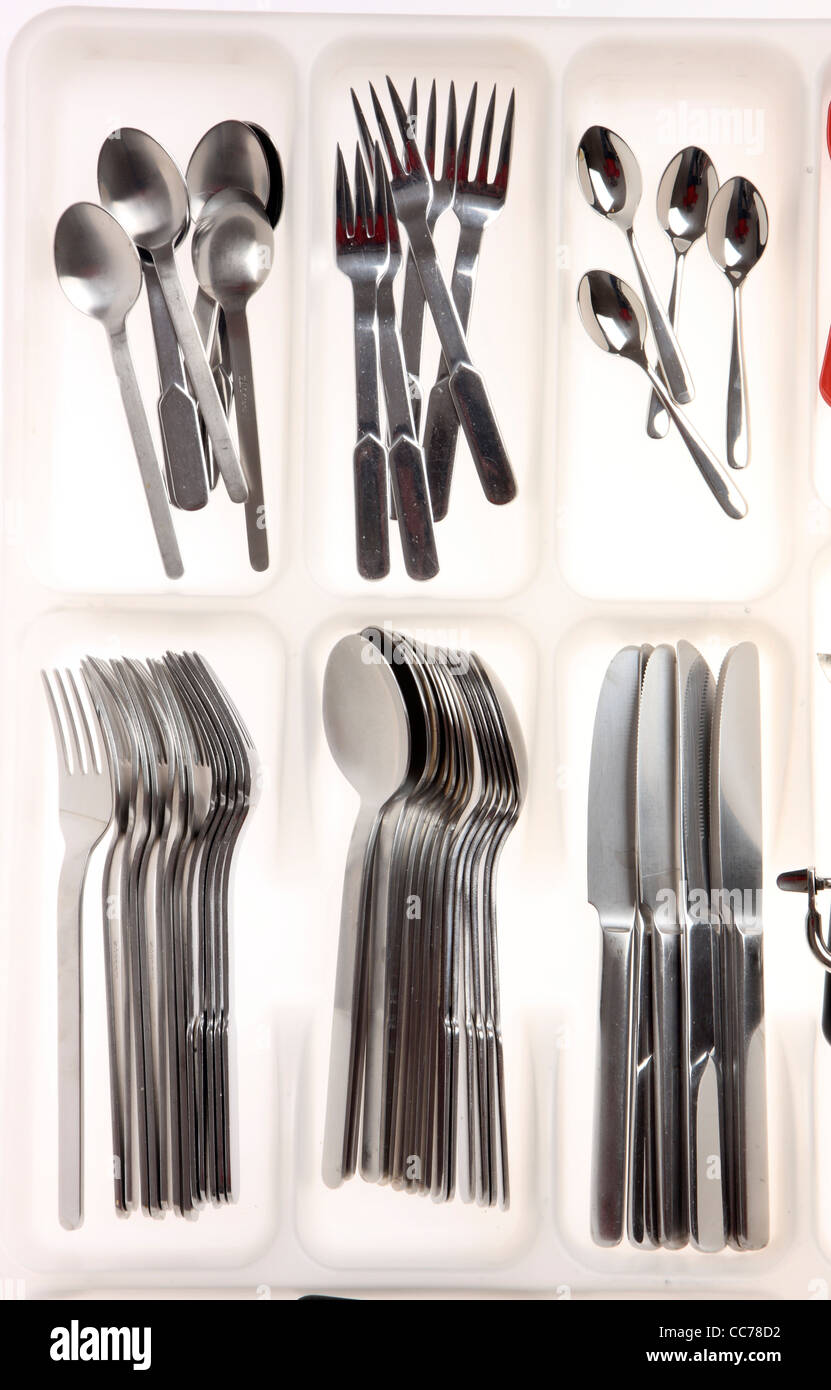 Various types of cutlery, kitchen tools, devices. In a drawer box, cutlery box. Stock Photo