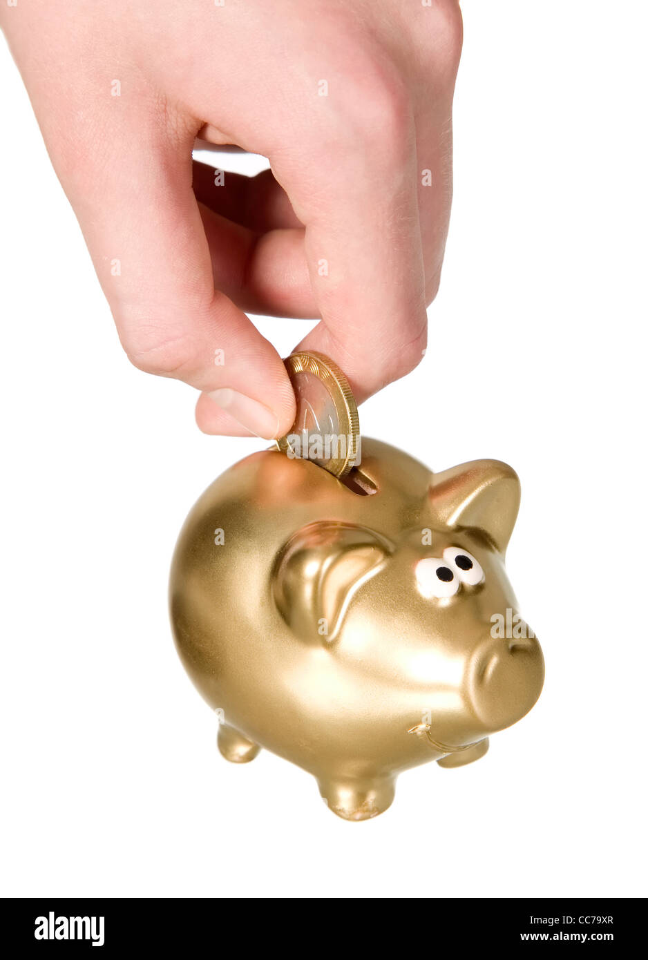 Man is putting coin to golden piggybank, savings concept Stock Photo ...