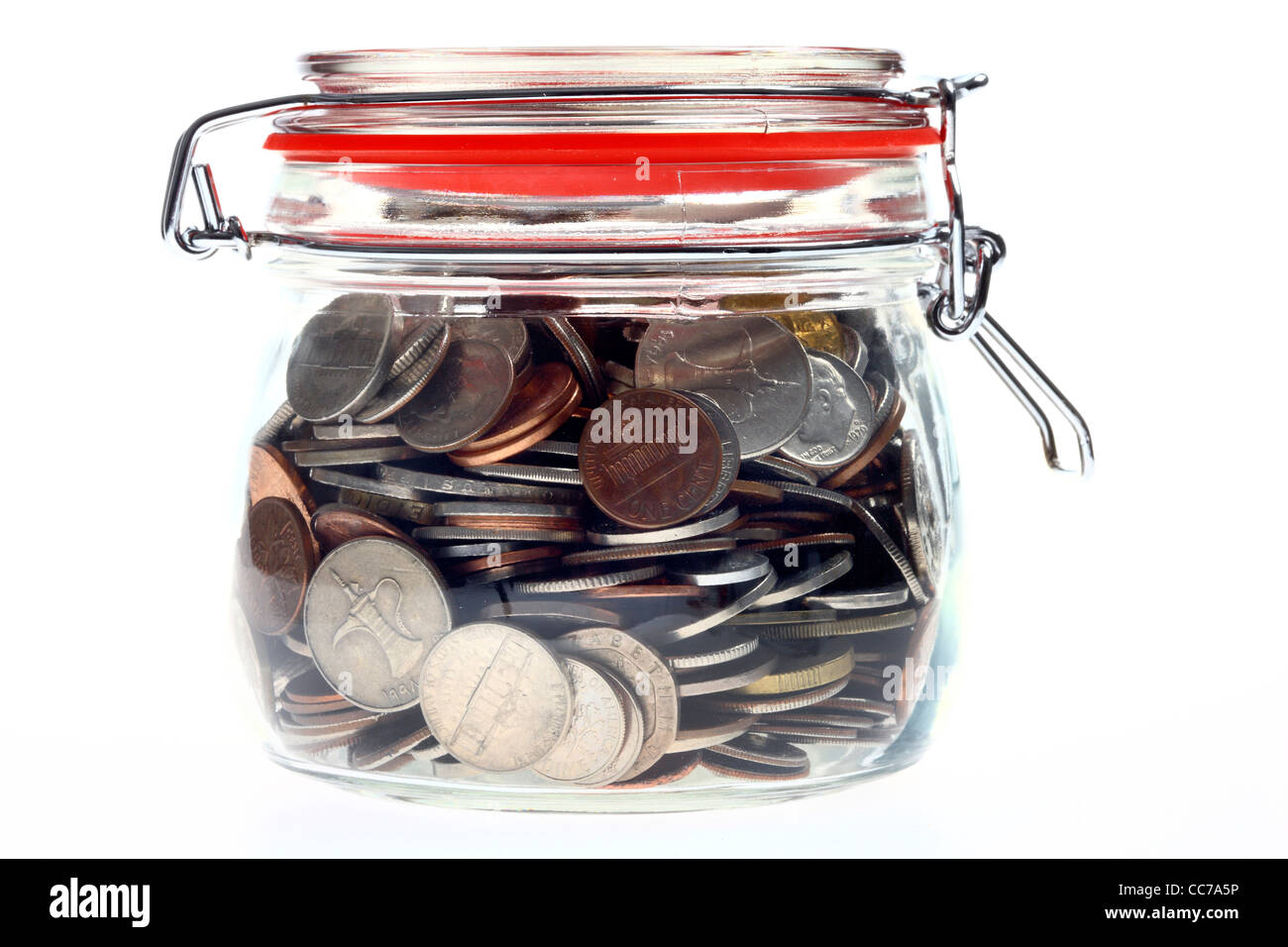 Money in a glass, preserving jar,  coins, different kinds of coins, from different country's, different currency's. Stock Photo