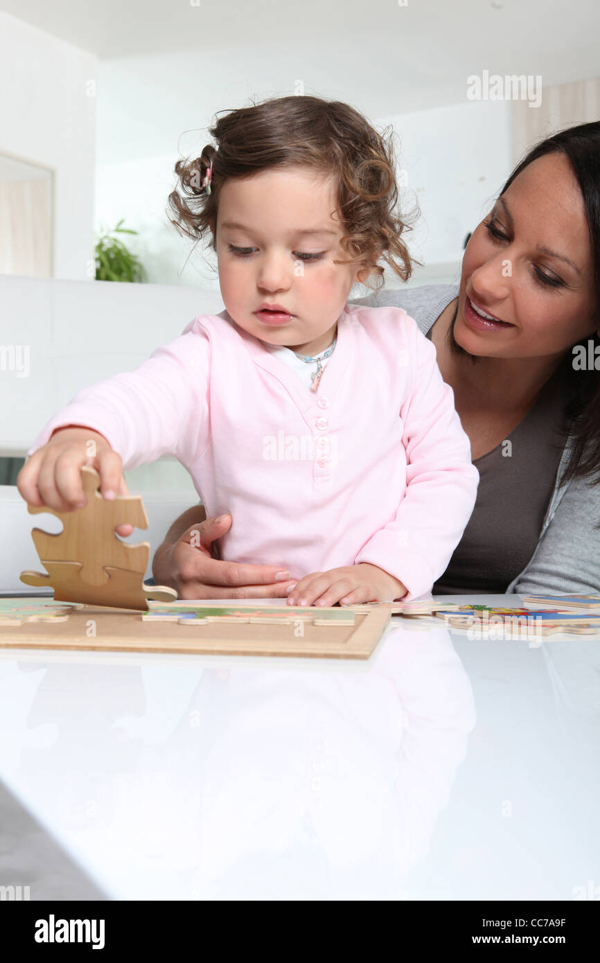 Mother and daughter doing a jigsaw puzzle Stock Photo Alamy