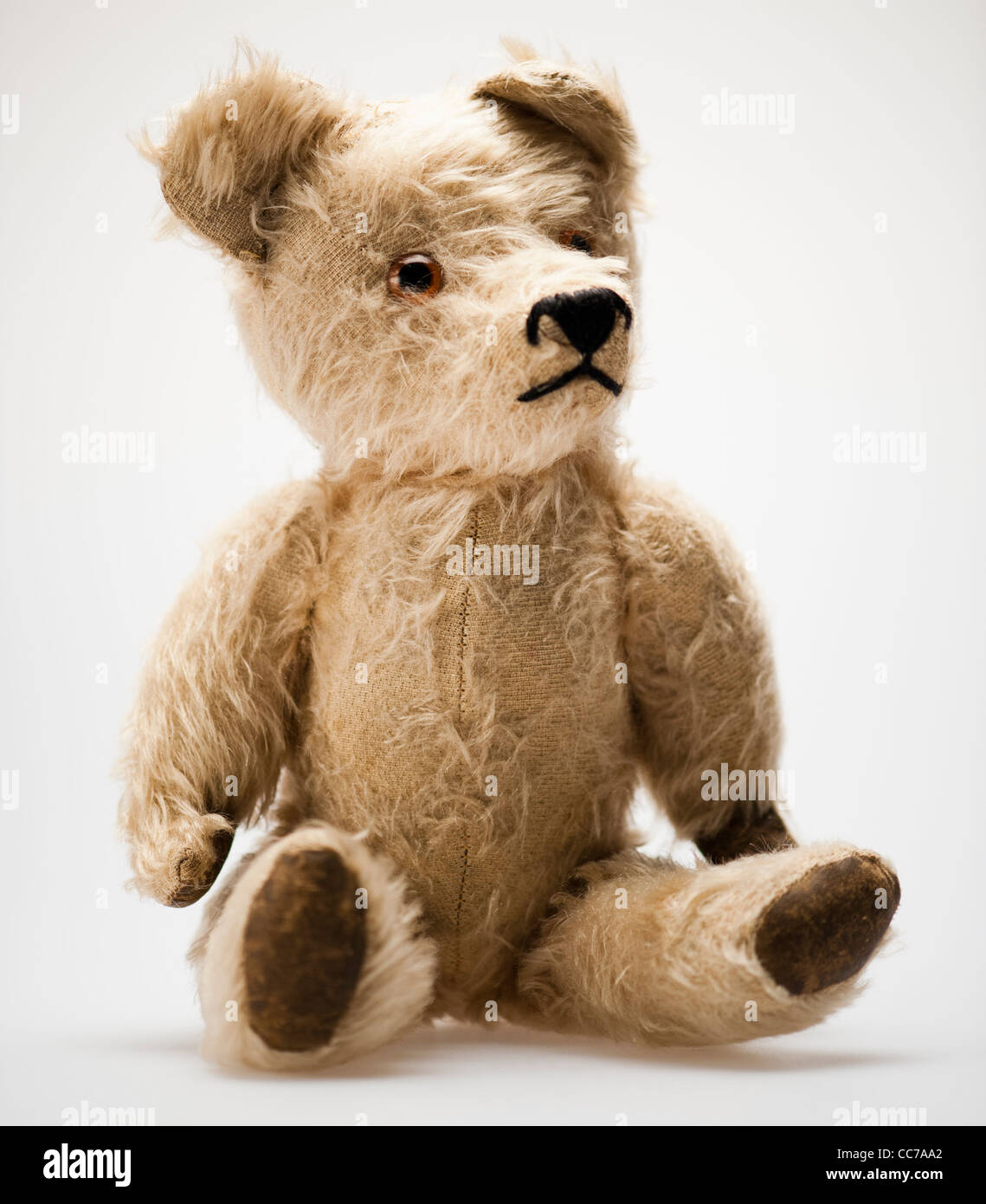 a battered threadbare old traditional childs stuffed toy teddy bear Stock Photo