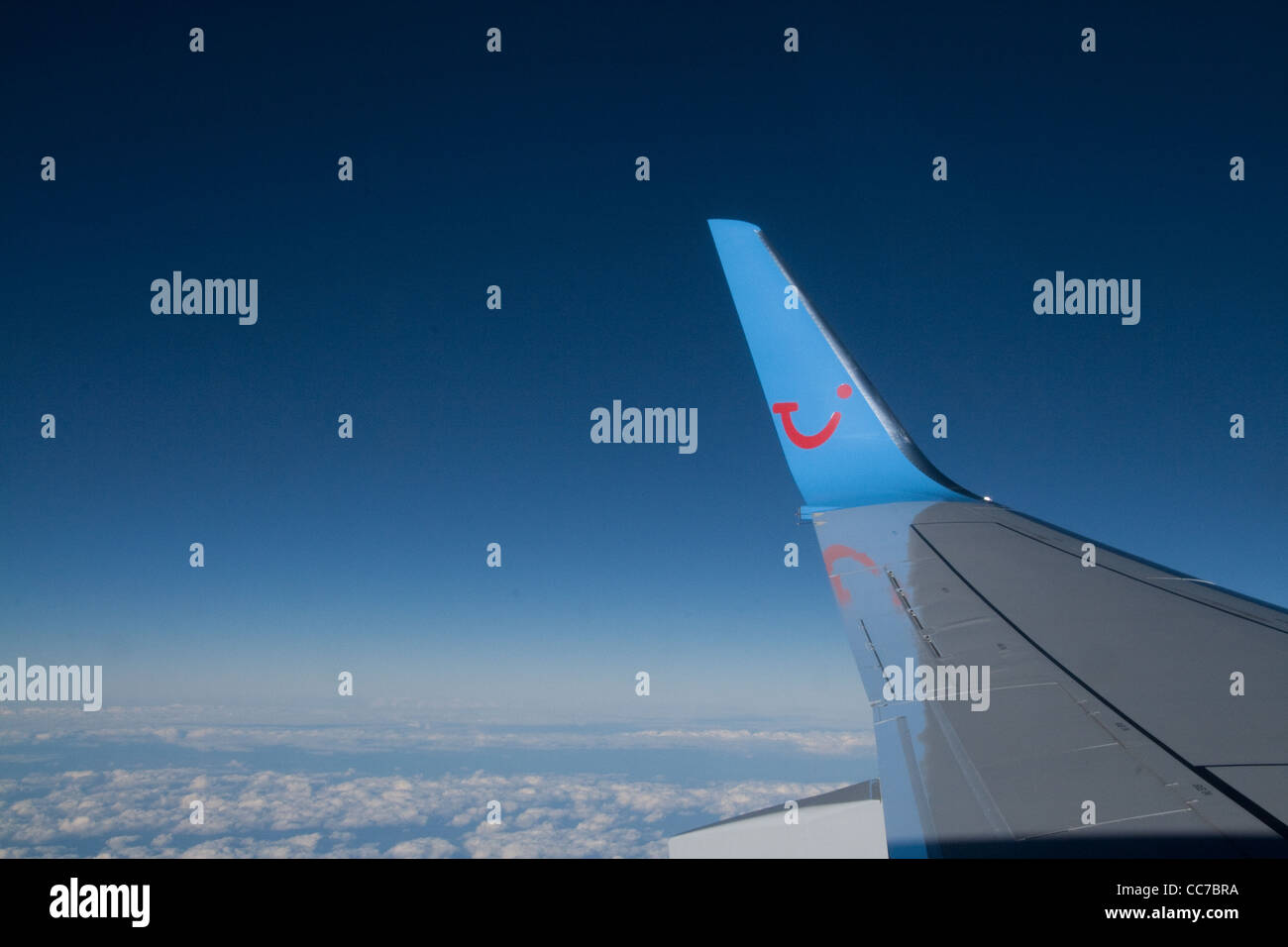 Thomson Airways airbus wing above cloud Stock Photo