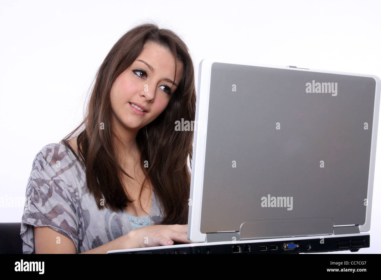 A young woman using a laptop Stock Photo - Alamy