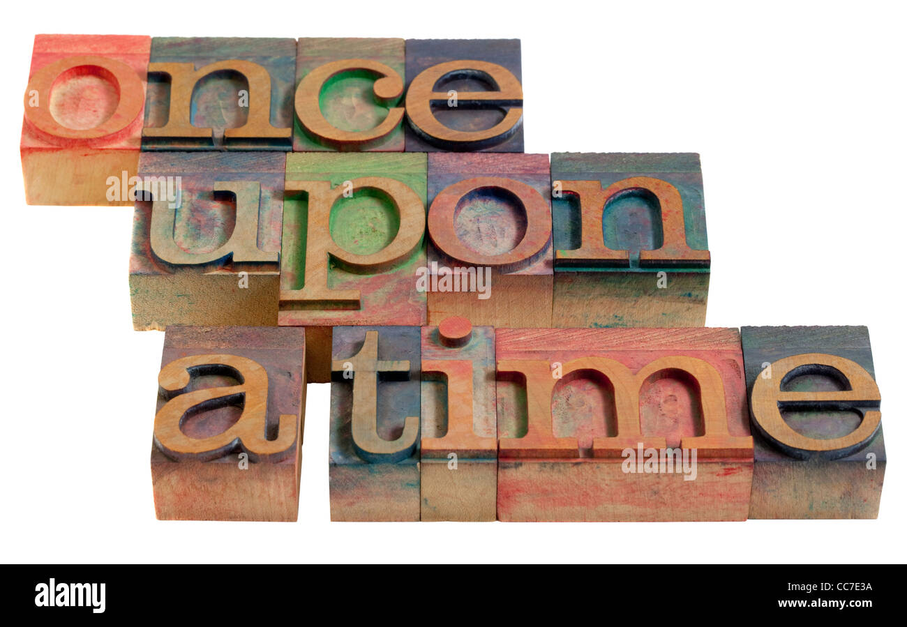 fairy story narration (opening phrase) - words in vintage wooden letterpress printing blocks, isolated on white Stock Photo
