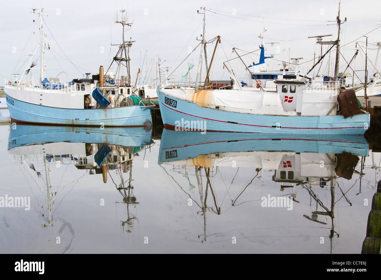 Fishing Boats, and their Reflections, in Harbour, Gilleleje, Sjaelland, Denmark Stock Photo