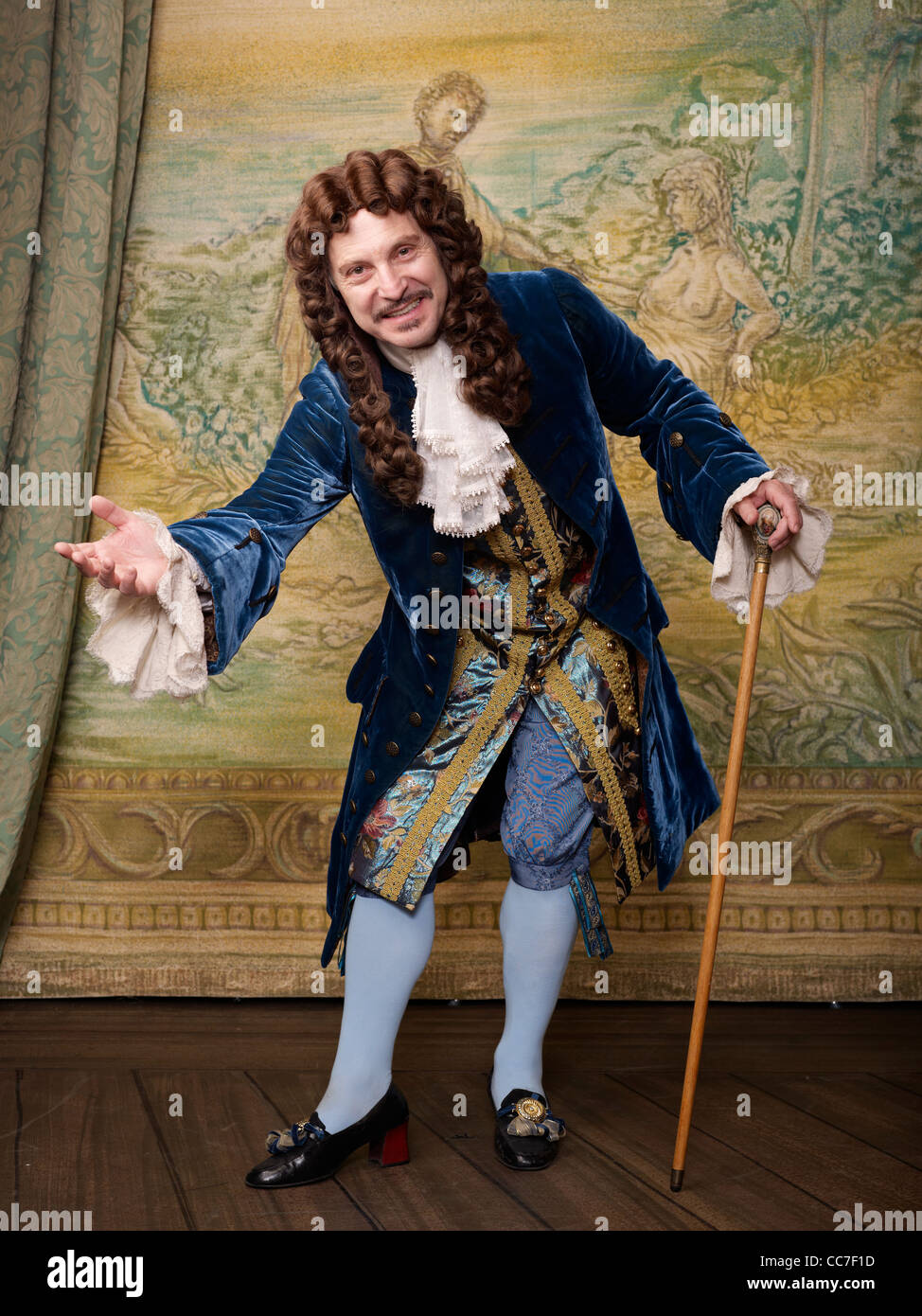 Actor dressed in old-fashioned costume on stage Stock Photo