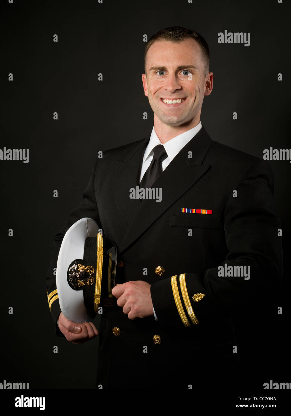 United States Navy Officer in Service Dress Blues Uniform with ...