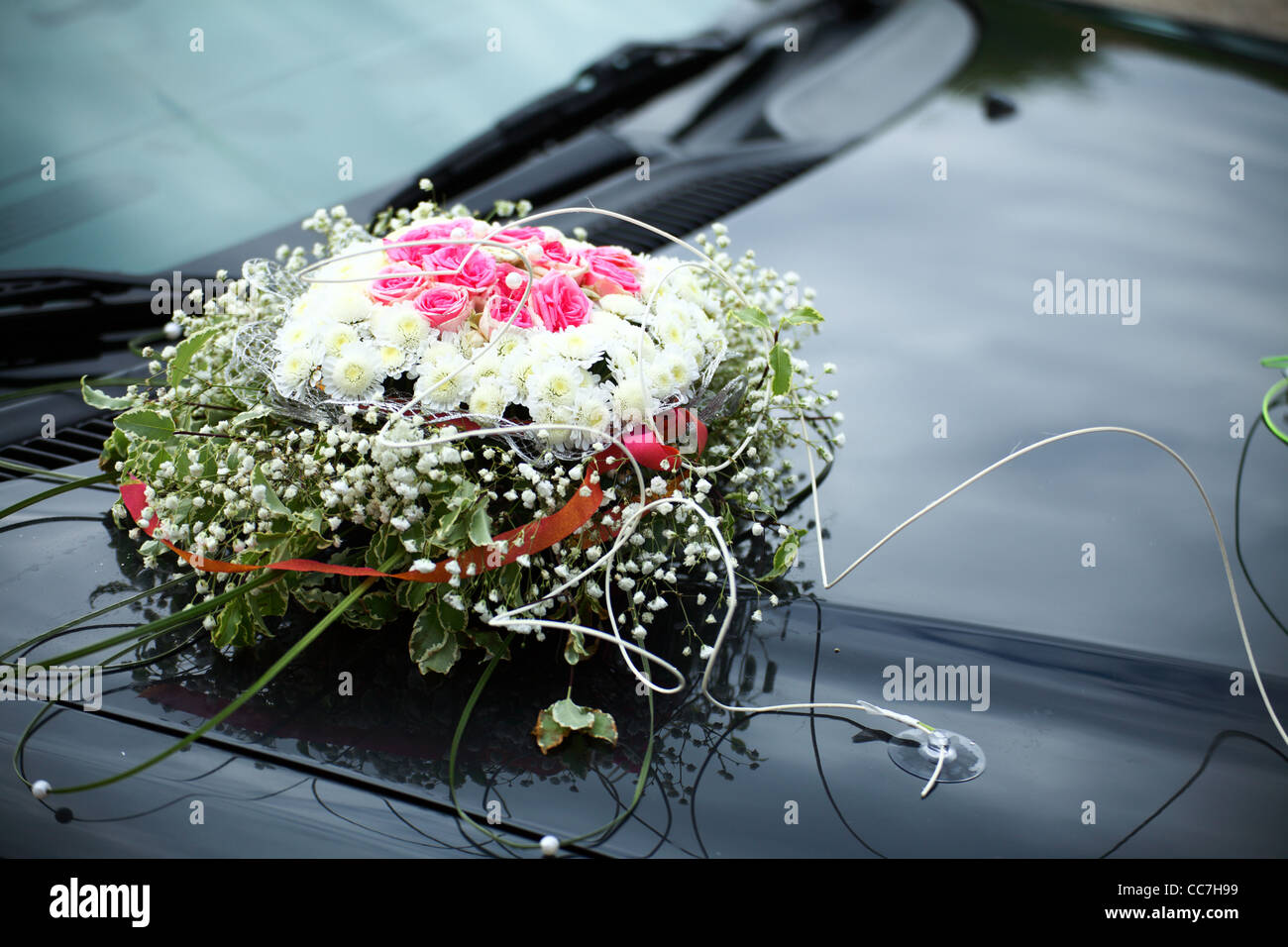Closeup view on flower decoration on modern wedding car Stock Photo - Alamy