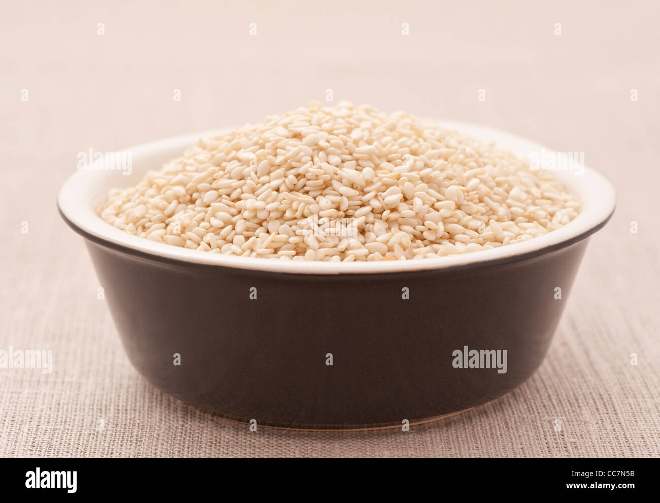 Bowl filled with Sesame Seeds Stock Photo