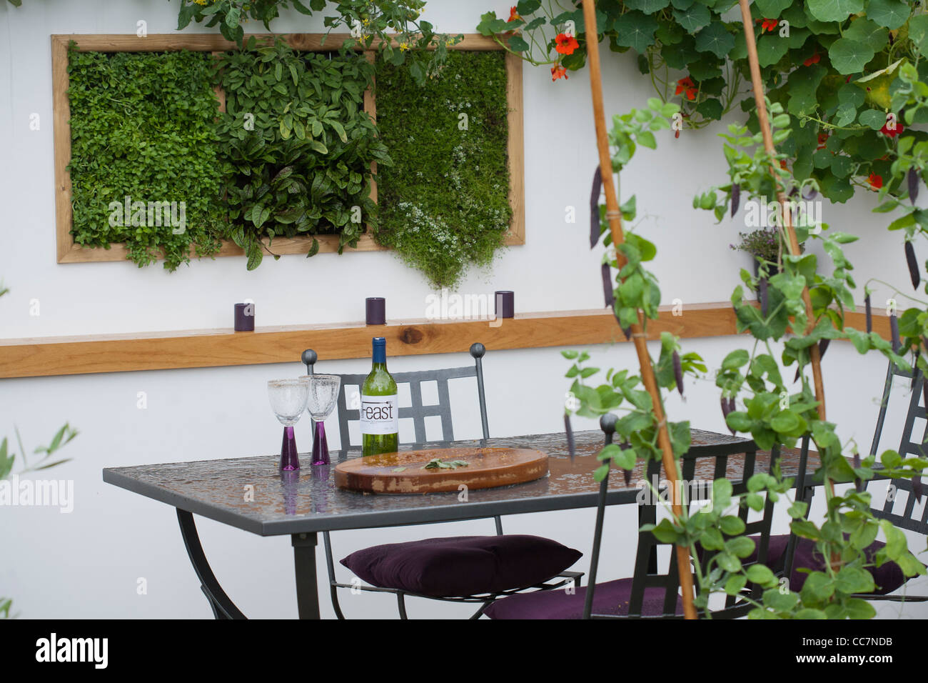 Dining area in contemporary garden design. Stock Photo