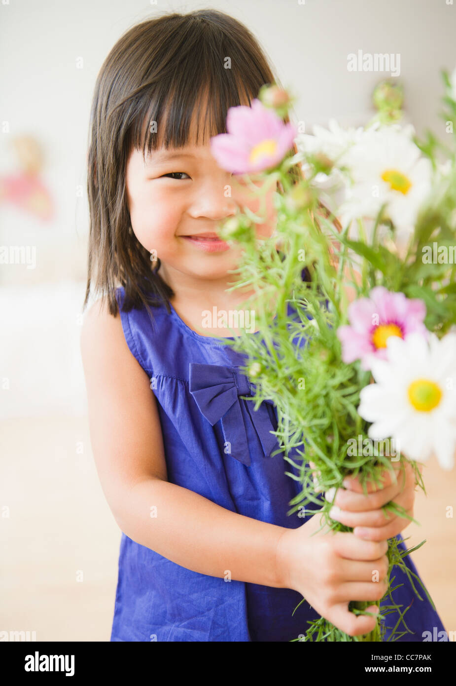 Korean girl holding bouquet of flowers Stock Photo