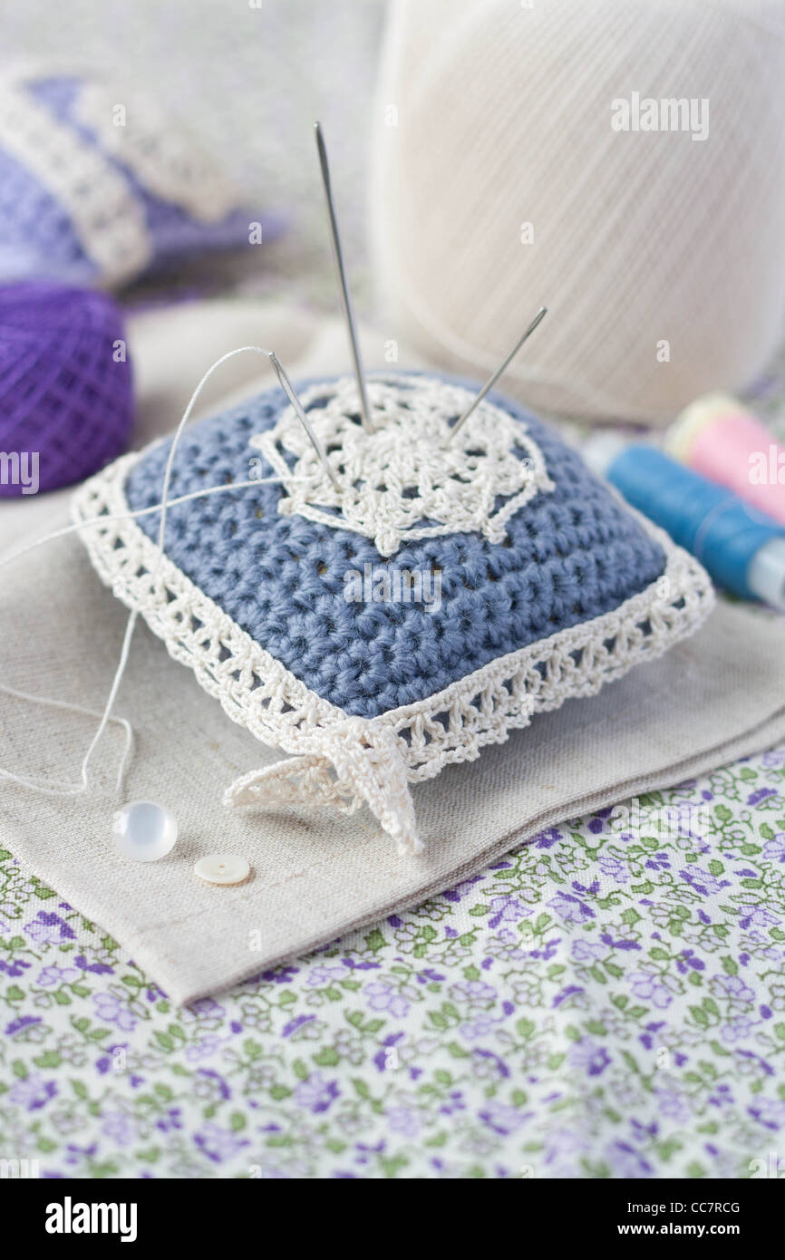 Crochet pincushion with needles Stock Photo