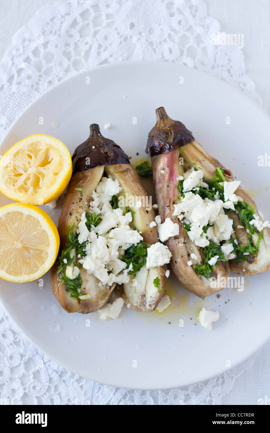 Grilled aubergines with olive oil, garlic, parsley and feta cheese from above Stock Photo