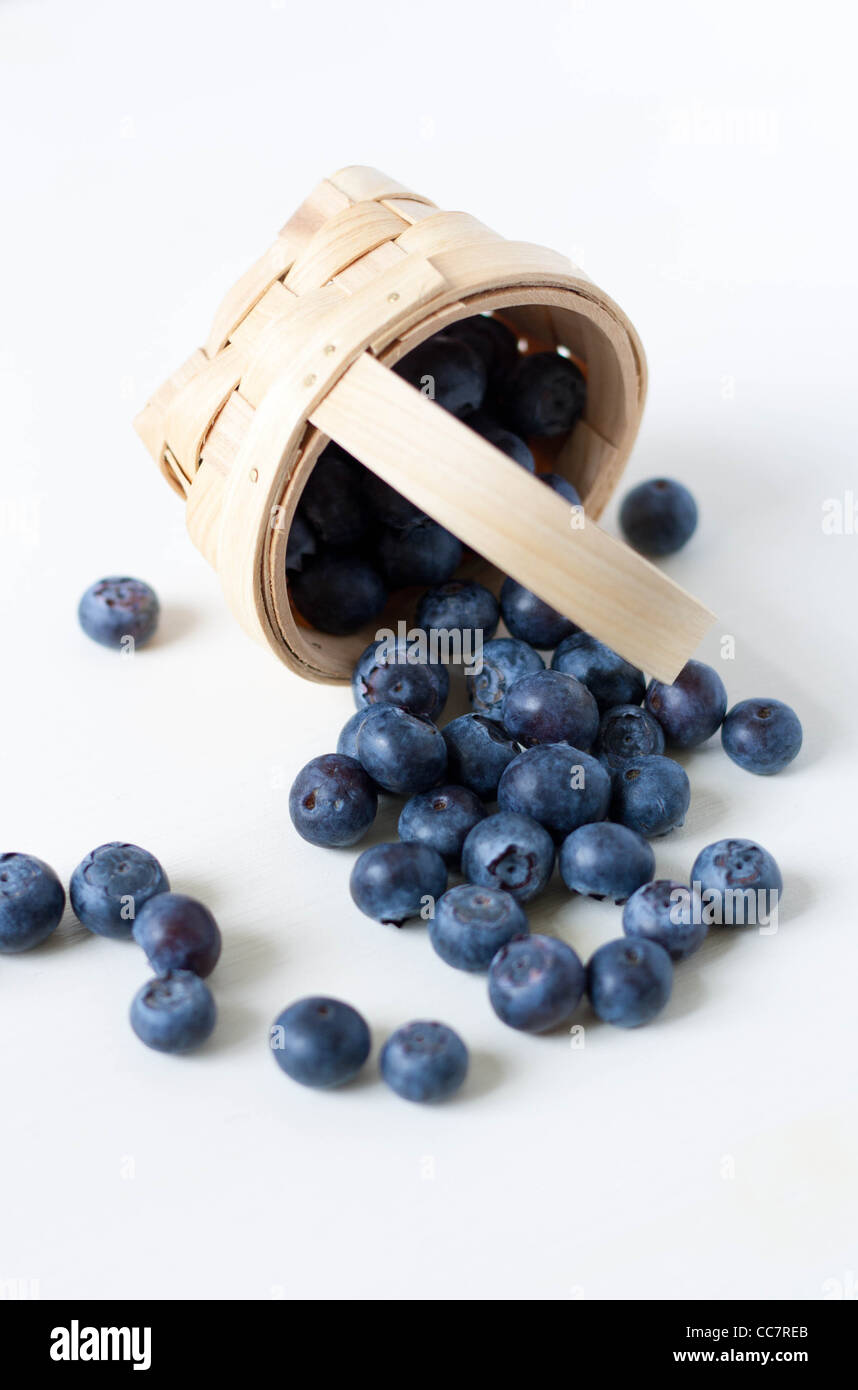 Blueberries in a basket on a table Stock Photo