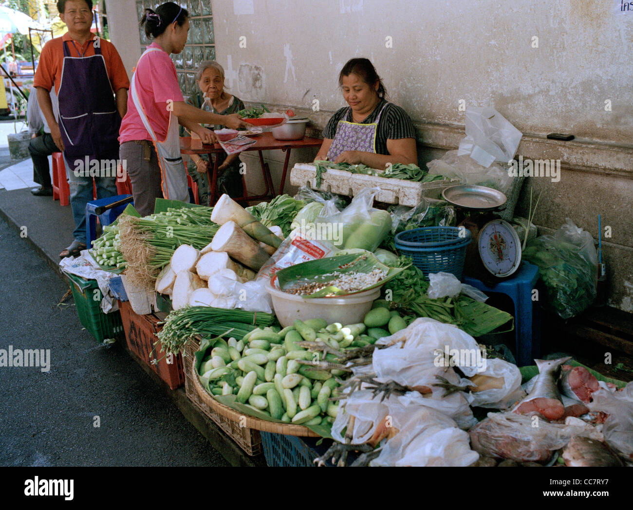 Vegetable market stall street scene in Silom in Bangkok in Thailand in Far East Southeast Asia. Trade Work Occupation Business Markets People Travel Stock Photo