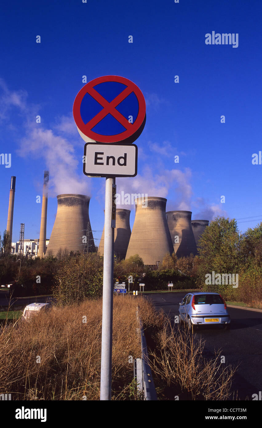 car driver passing end of no stopping area roadsign by Ferrybridge coal powered station Yorkshire UK Stock Photo