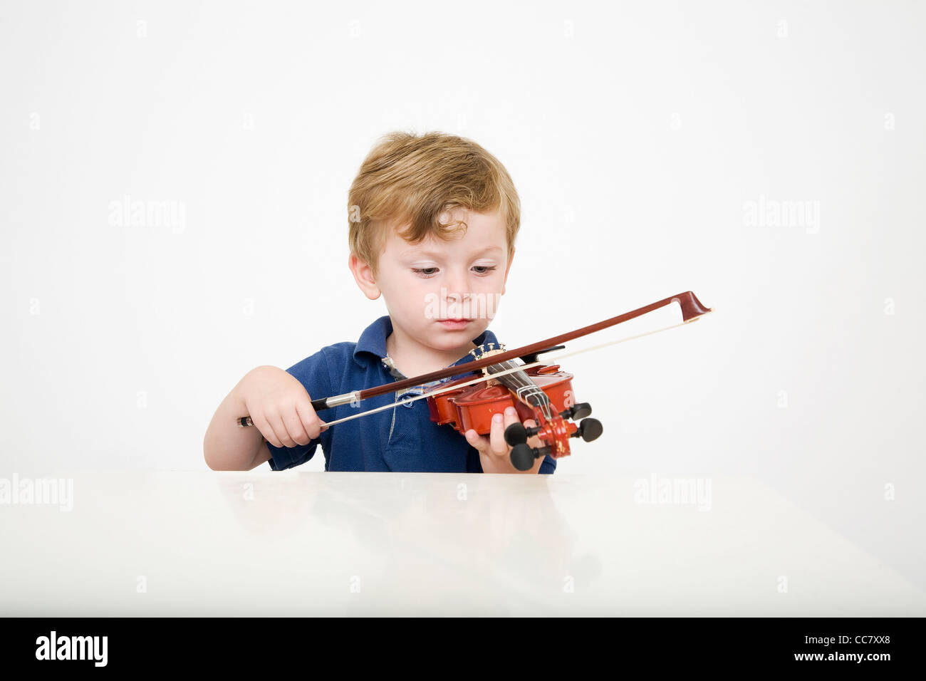 Young Boy Playing Violin Stock Photo