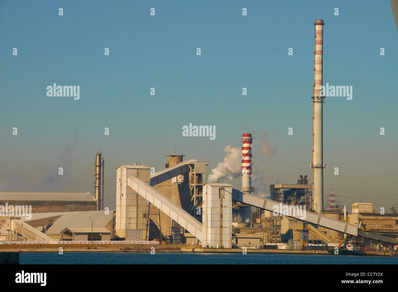 bulk business cargo carrier commerce commercial container crane delivery dock dusk evening