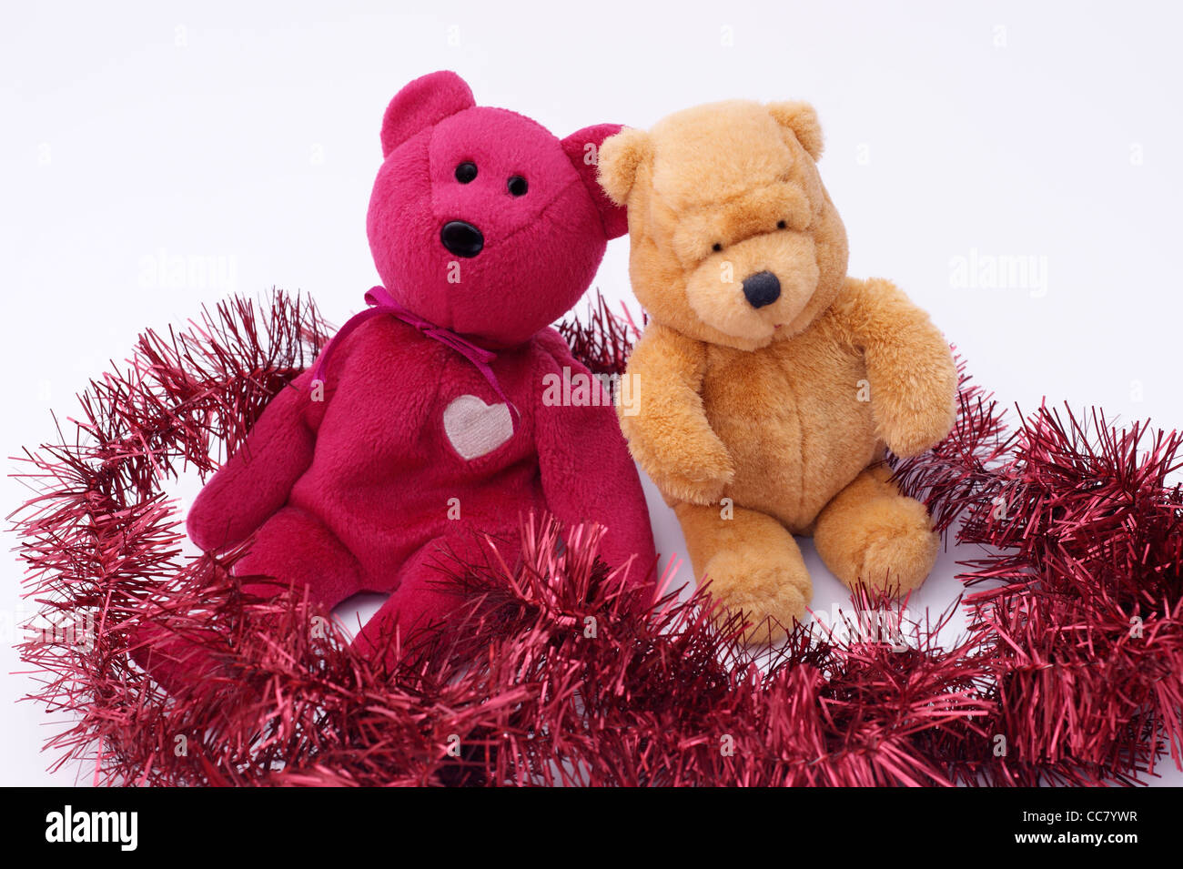 teddy bears with tinsel Christmas decorations on a white background Stock  Photo - Alamy