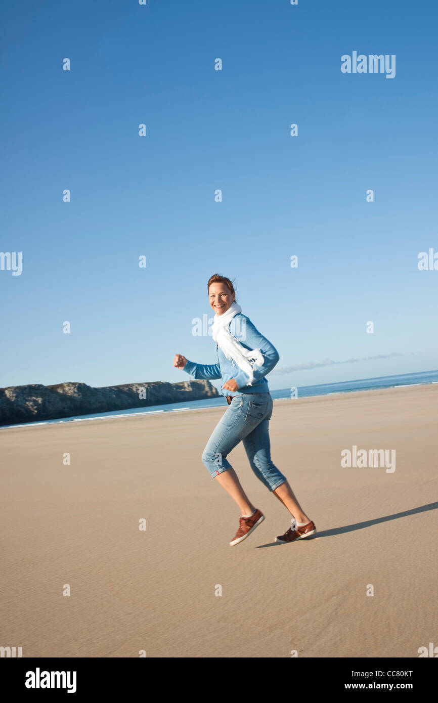 Woman On Beach, Camaret-sur-Mer, Finistere, Bretagne, France Stock Photo