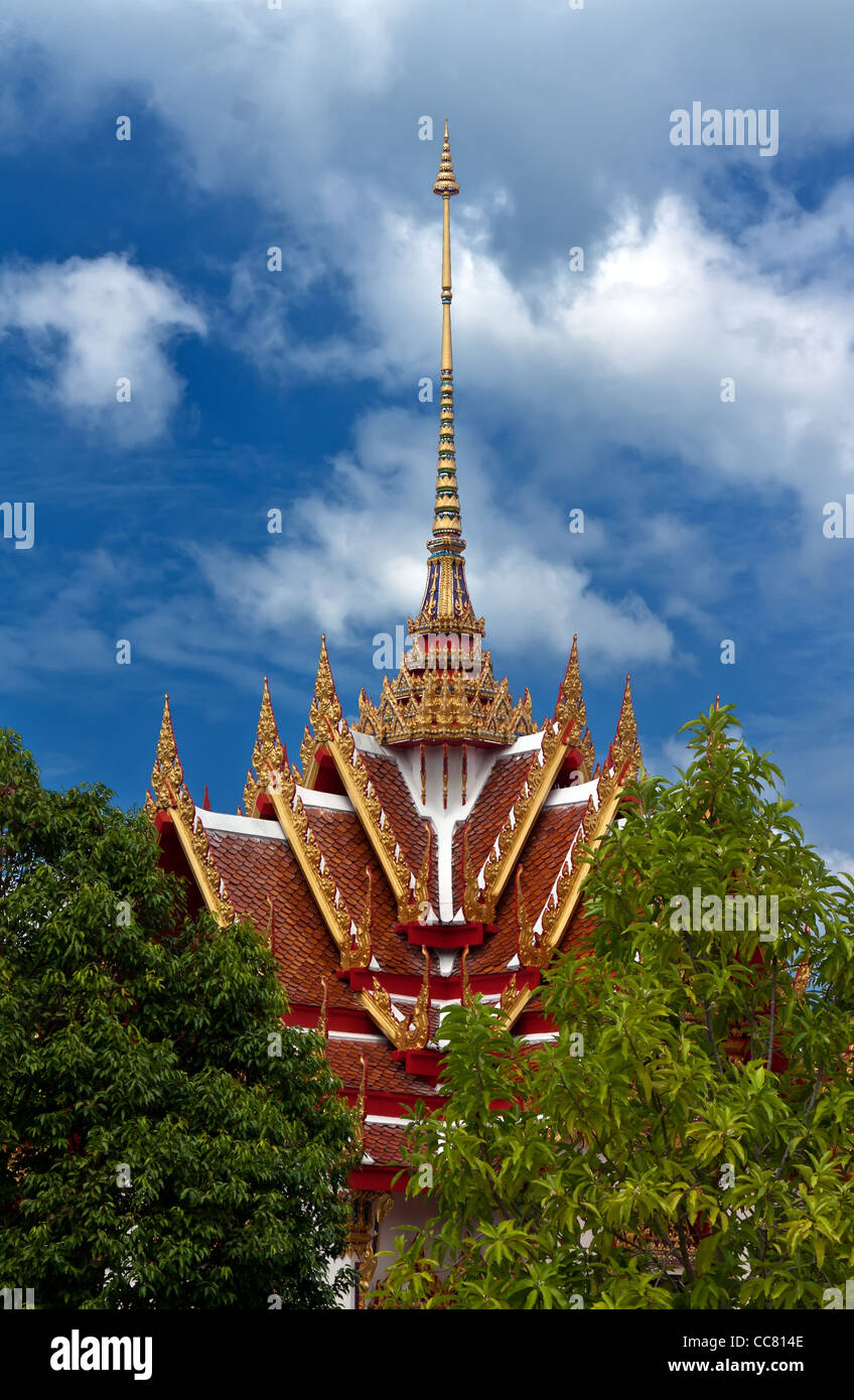 Beautiful Thai temple against the blue sky with clouds Stock Photo - Alamy