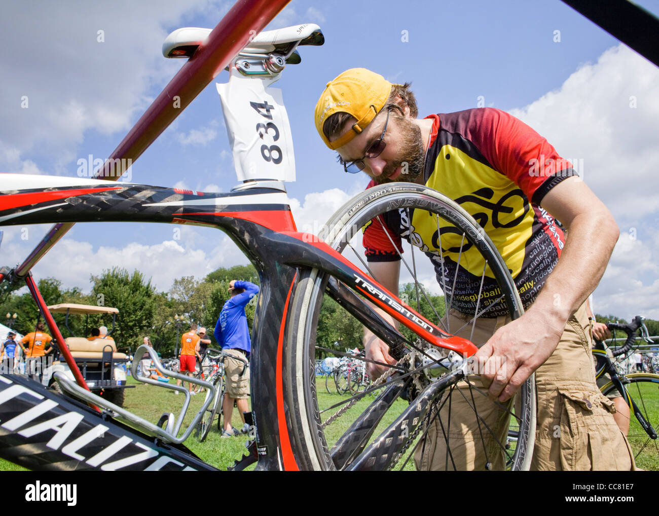 A bicycle technician checking a wheel Stock Photo