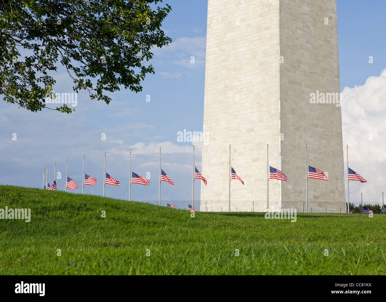 Row of American flags flying half staff at the Washington Monument Stock Photo Alamy