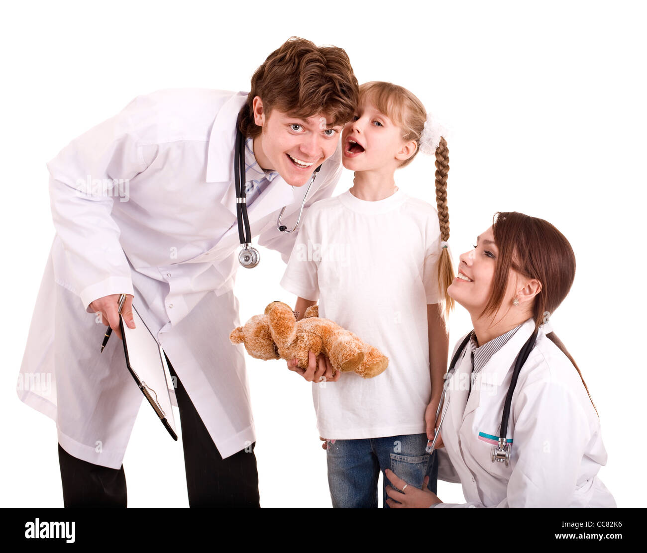 Two paediatrician treat happy child. Stock Photo