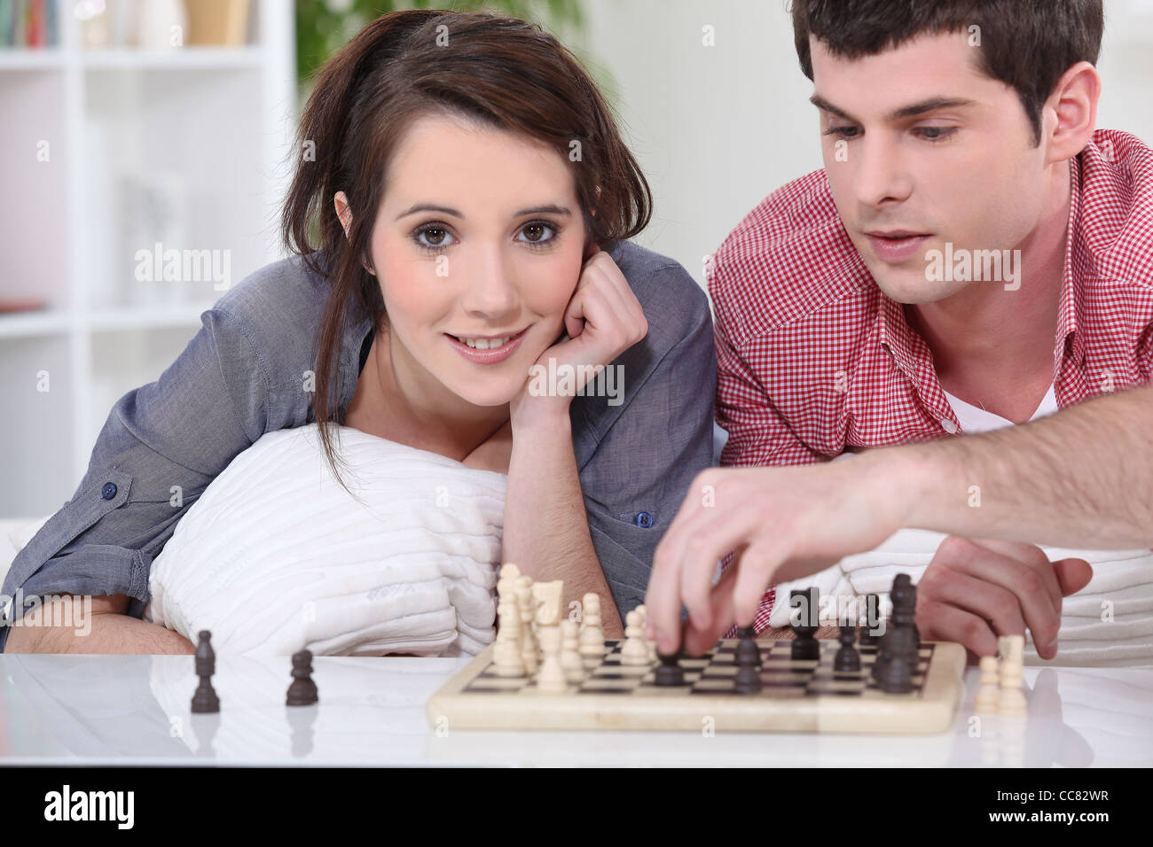 Teenagers playing chess. Chess dalmax. Папа и сын играют в шахматы. Игра в шахматы дети. Мальчик с шахматами.