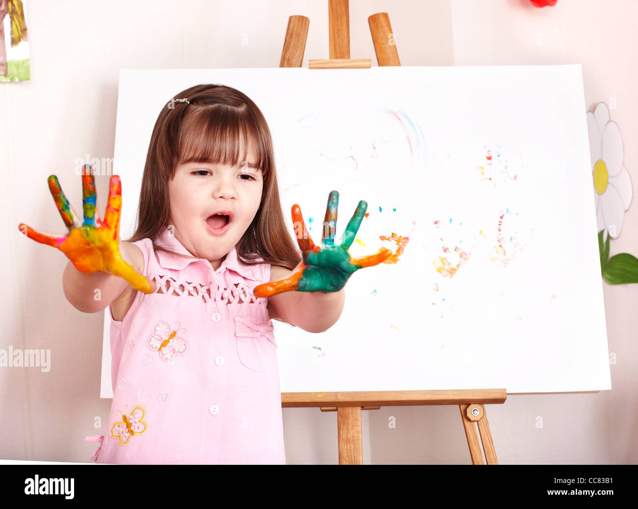 Child making handprints with paint Stock Photo Alamy