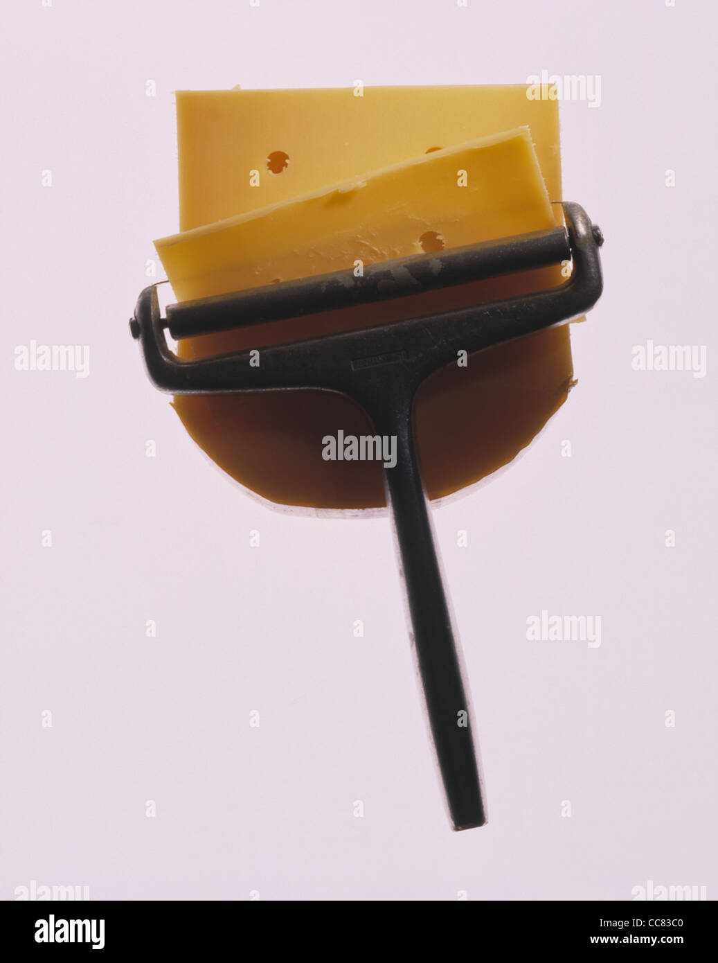 Cheese cutter with gouda cheese Stock Photo Alamy