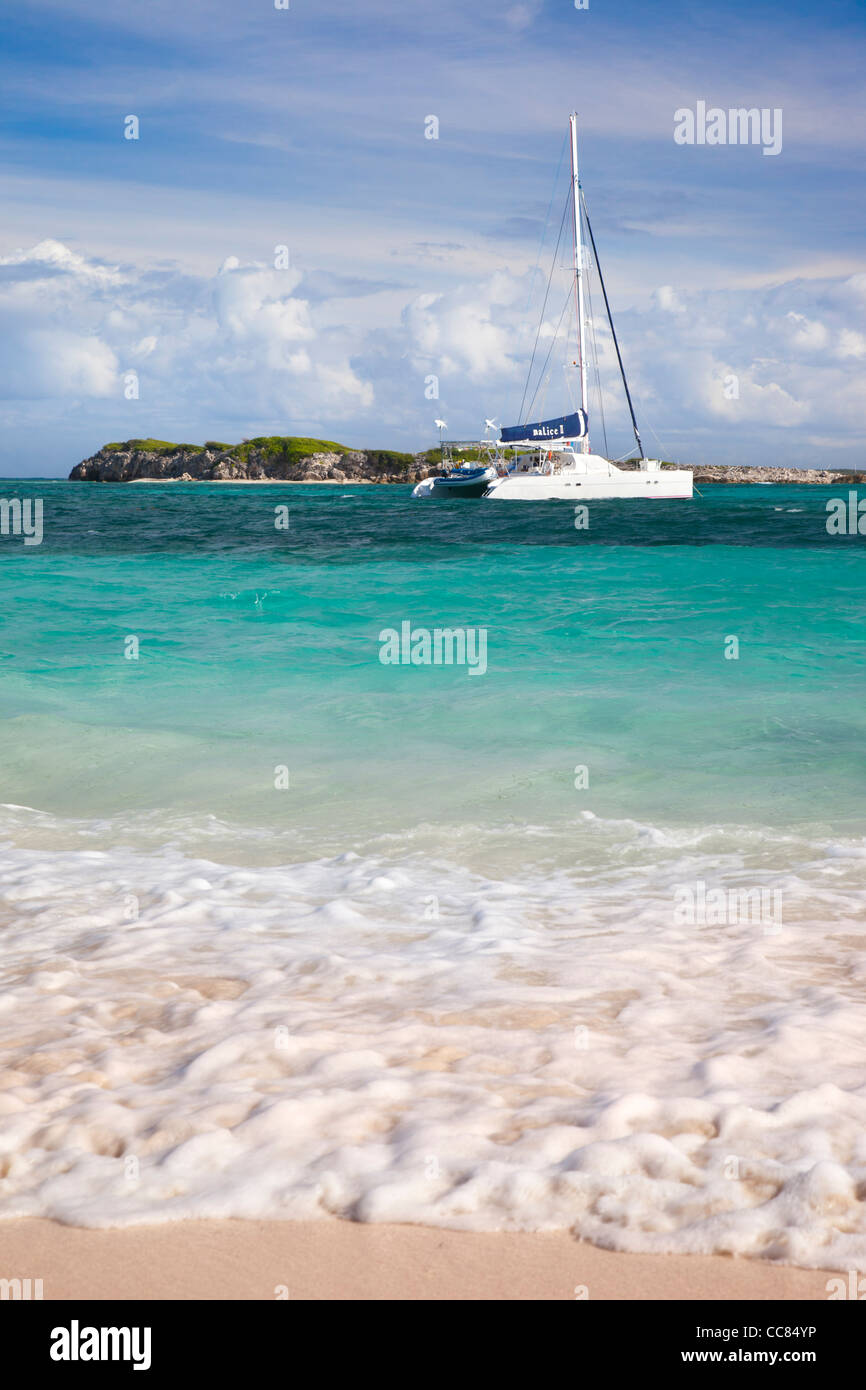 Catamaran moored off Orient Beach on St. Maarten, French West Indies Stock Photo