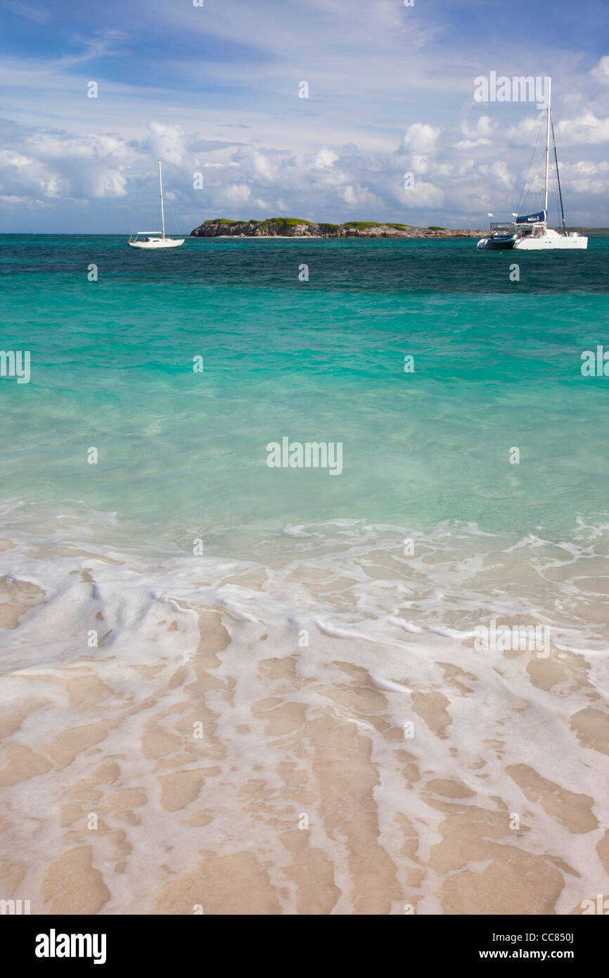Boats moored off Orient Beach on Saint Maarten, French West Indies Stock Photo