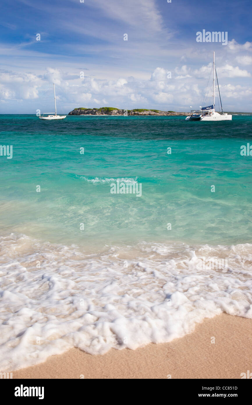 Boats moored off Orient Beach in St. Maarten, French West Indies Stock Photo