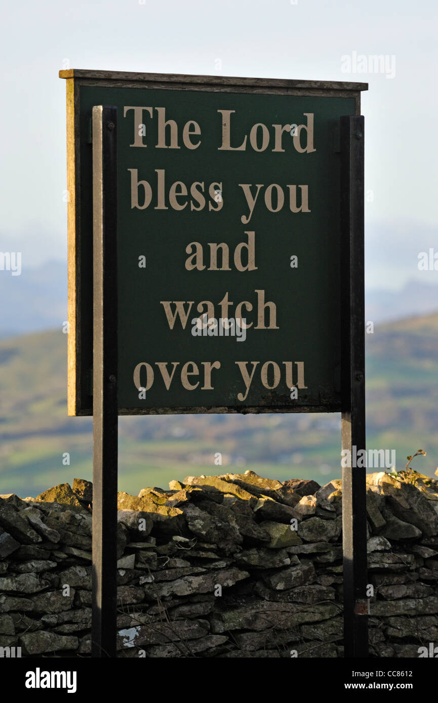 'The Lord bless you and watch over you', notice board. Church of Saint John, Helsington. Brigsteer, Kendal, Cumbria, England. Stock Photo