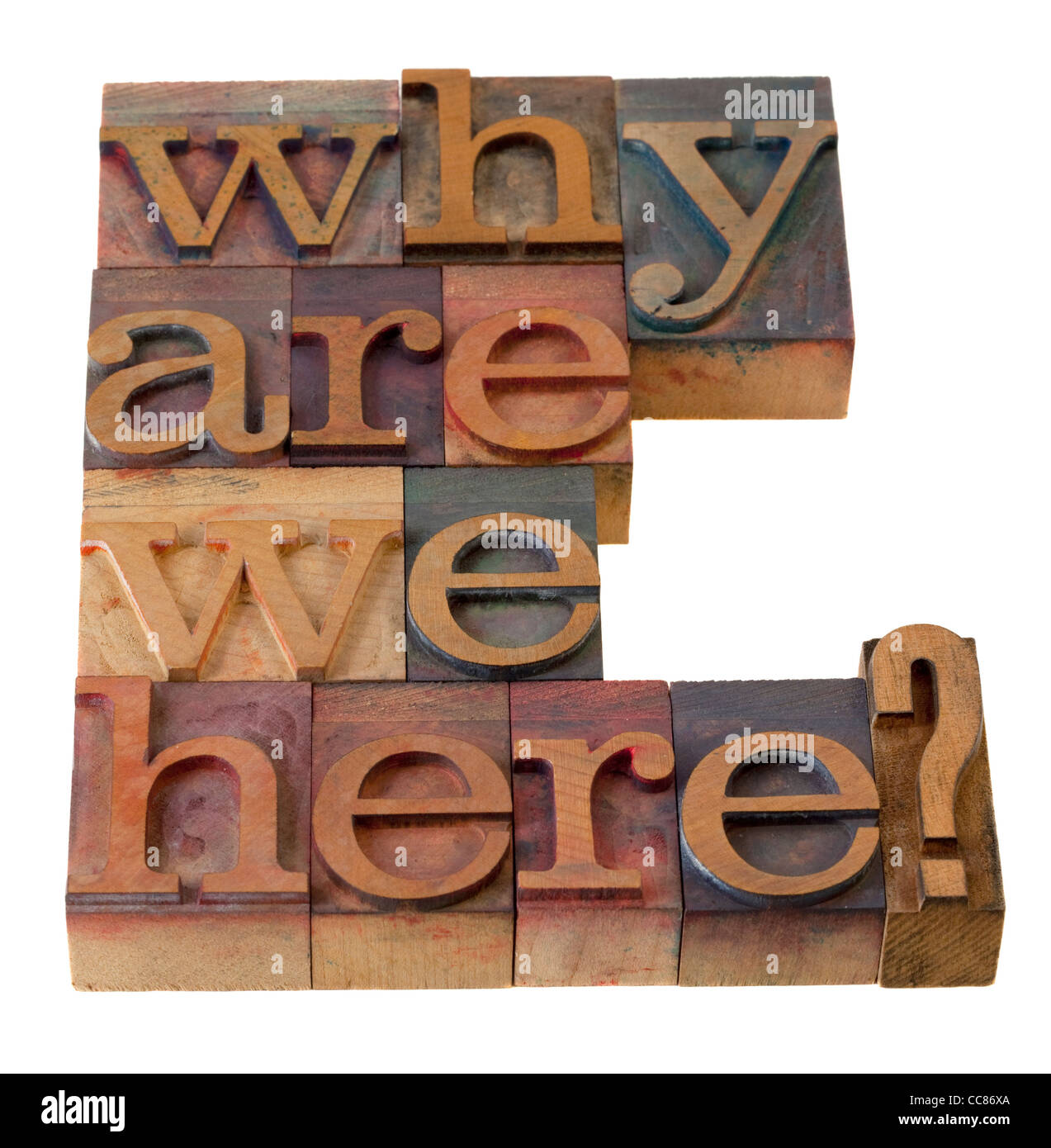 philosophical question, why are we here , in vintage wooden letterpress printing blocks, stained by color inks Stock Photo
