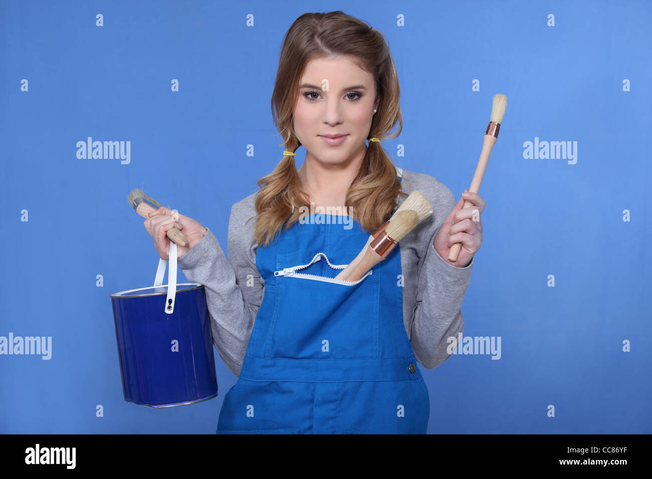 Cheerful woman holding paint brush hi-res stock photography and images ...