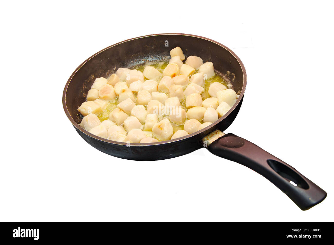 Preparing saute of scallops (with butter) in a frying pan Stock Photo