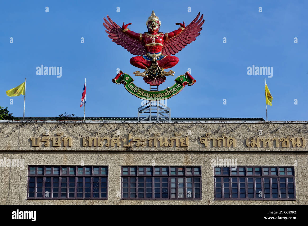 Garuda symbol for royal warrant at Deves Insurance Building, Rajadamnoen Klang Avenue, Bangkok. Stock Photo