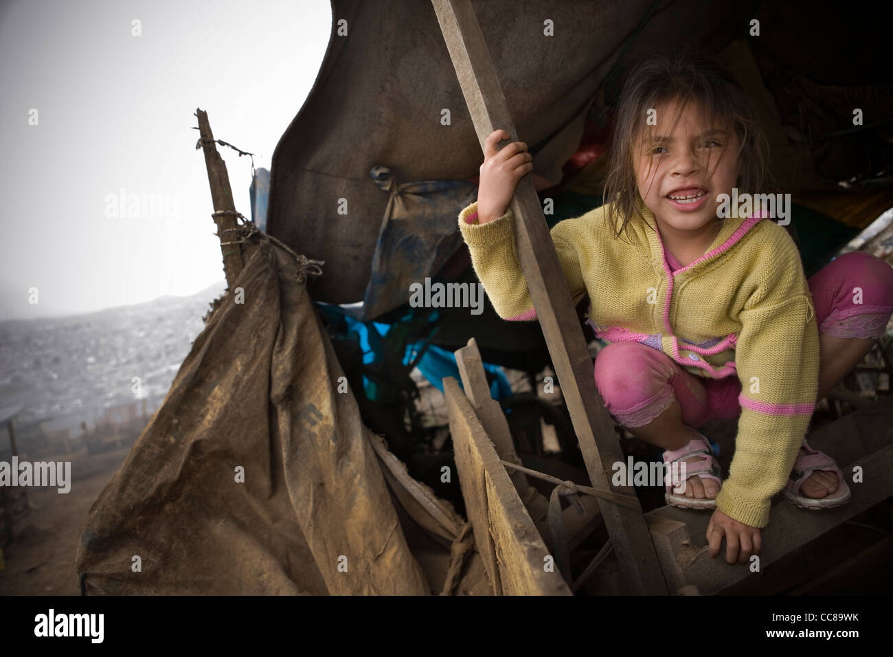 A girl in Villa el Salvador, a slum in Lima, Peru, South America. Stock Photo