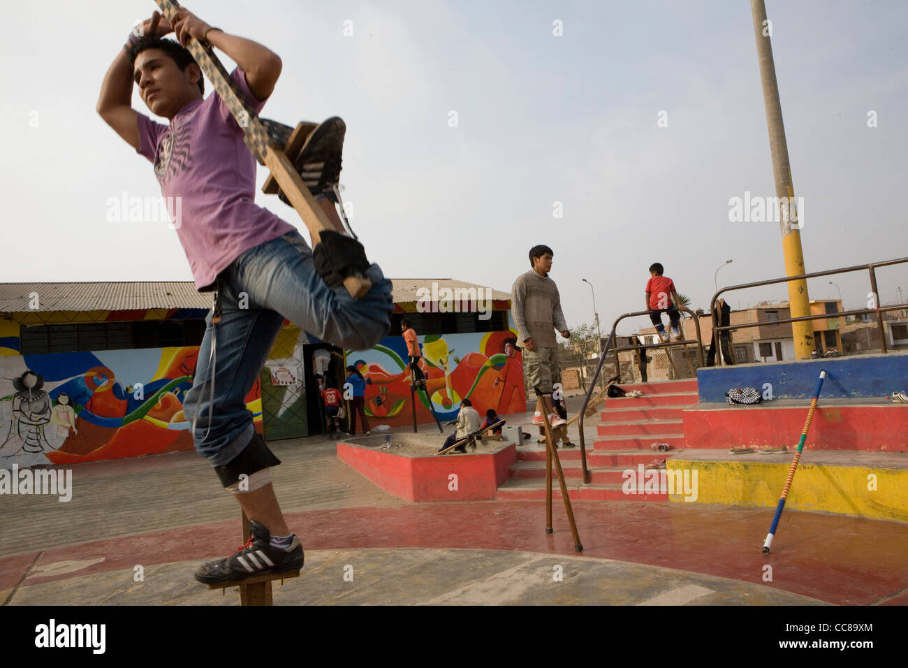 Youth practice walking on stilts in Lima, Peru, South America Stock Photo