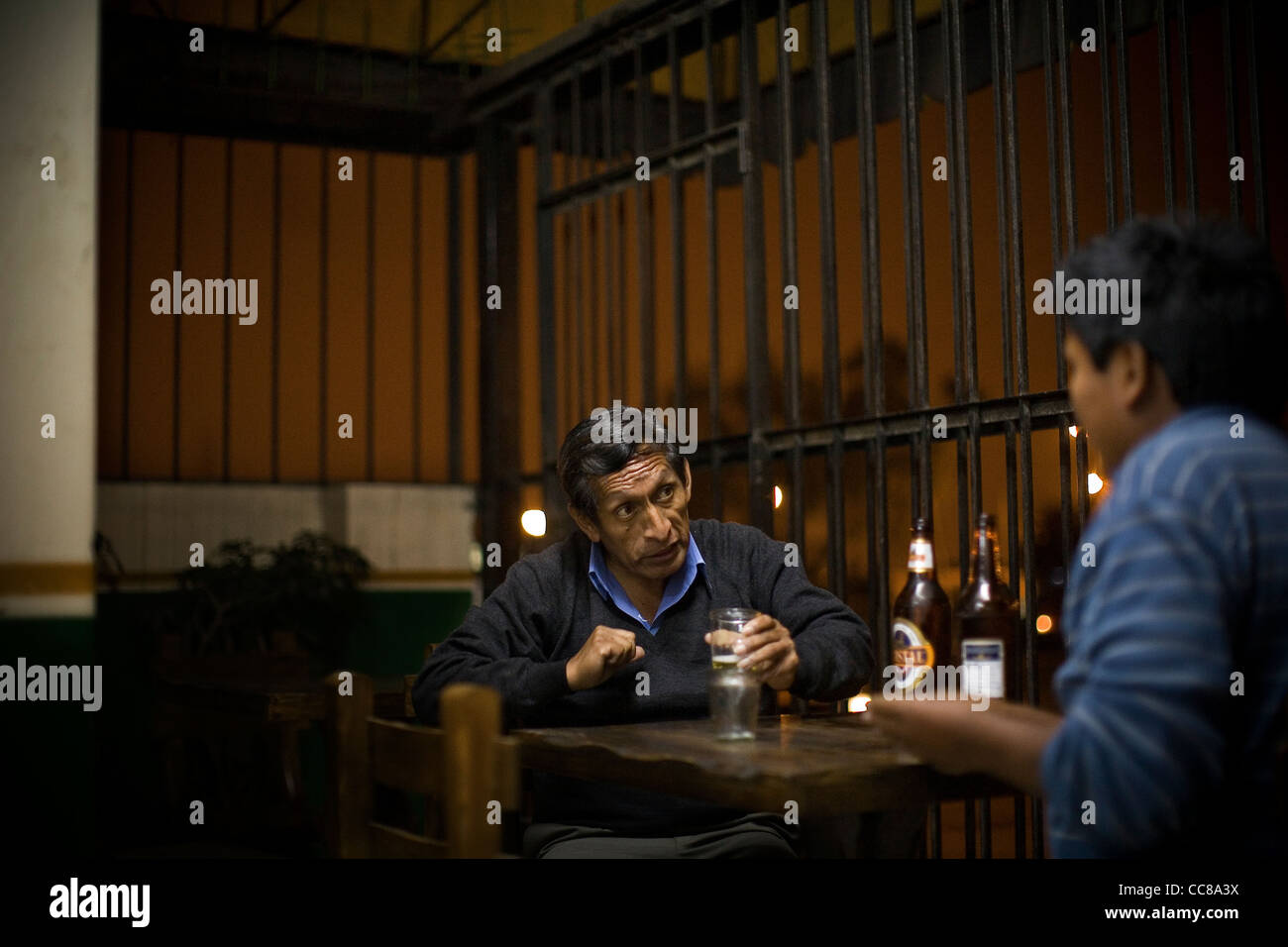 Men drink in a bar in Villa el Salvador in Lima, Peru, South America. Stock Photo