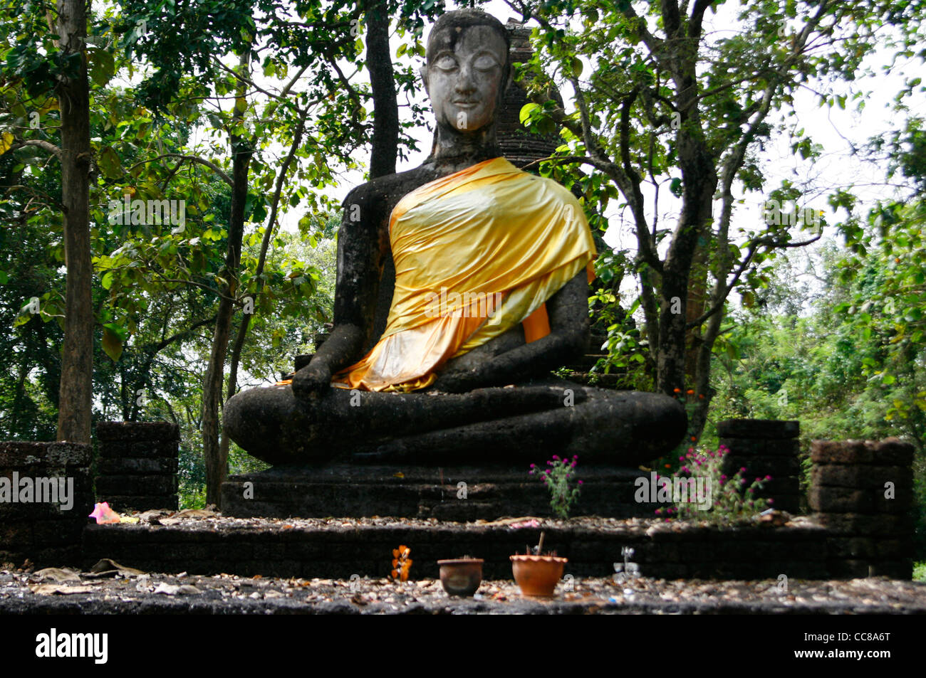 Seated Buddha of the 'Wat Khao Phanom Phloeng' temple inside the 'Si Satchanalai Historical park'. Sukothai, Thailand. Stock Photo