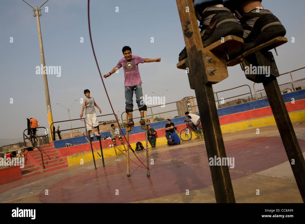 Youth practice walking on stilts in Lima, Peru, South America Stock Photo