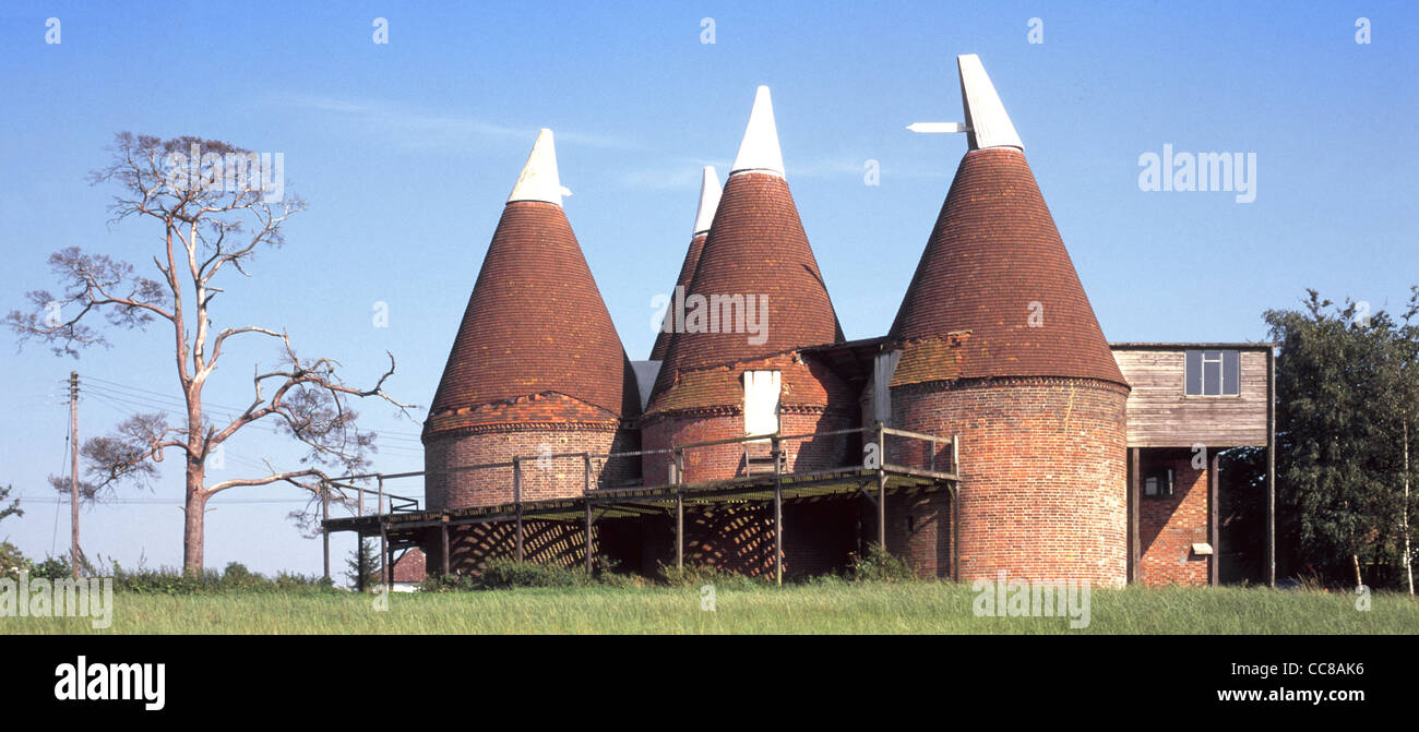 Historical & listed building Oast house used for kiln drying of  hops part of beer brewing awaiting conversion to homes in Kent English countryside UK Stock Photo