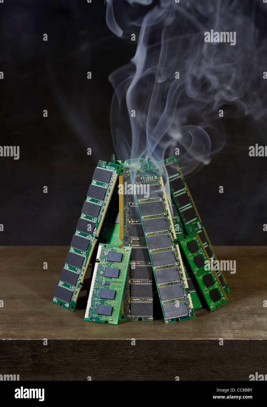 pile of random access memory sticks and some smoke in front of dark