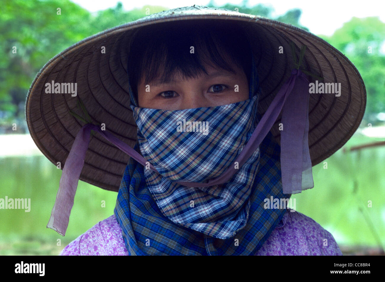 Portrait pretty girl wearing face scarf Mekong Delta Vietnam Stock Photo