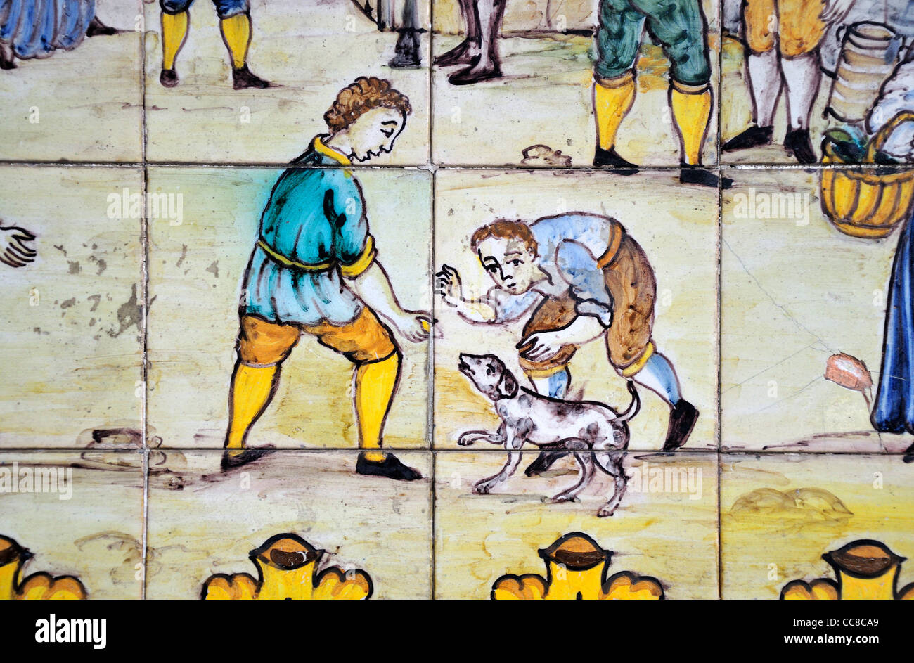 Barcelona, Spain. Tiled picture on Calle de la Portaferrissa. Detail showing two boys with dog Stock Photo