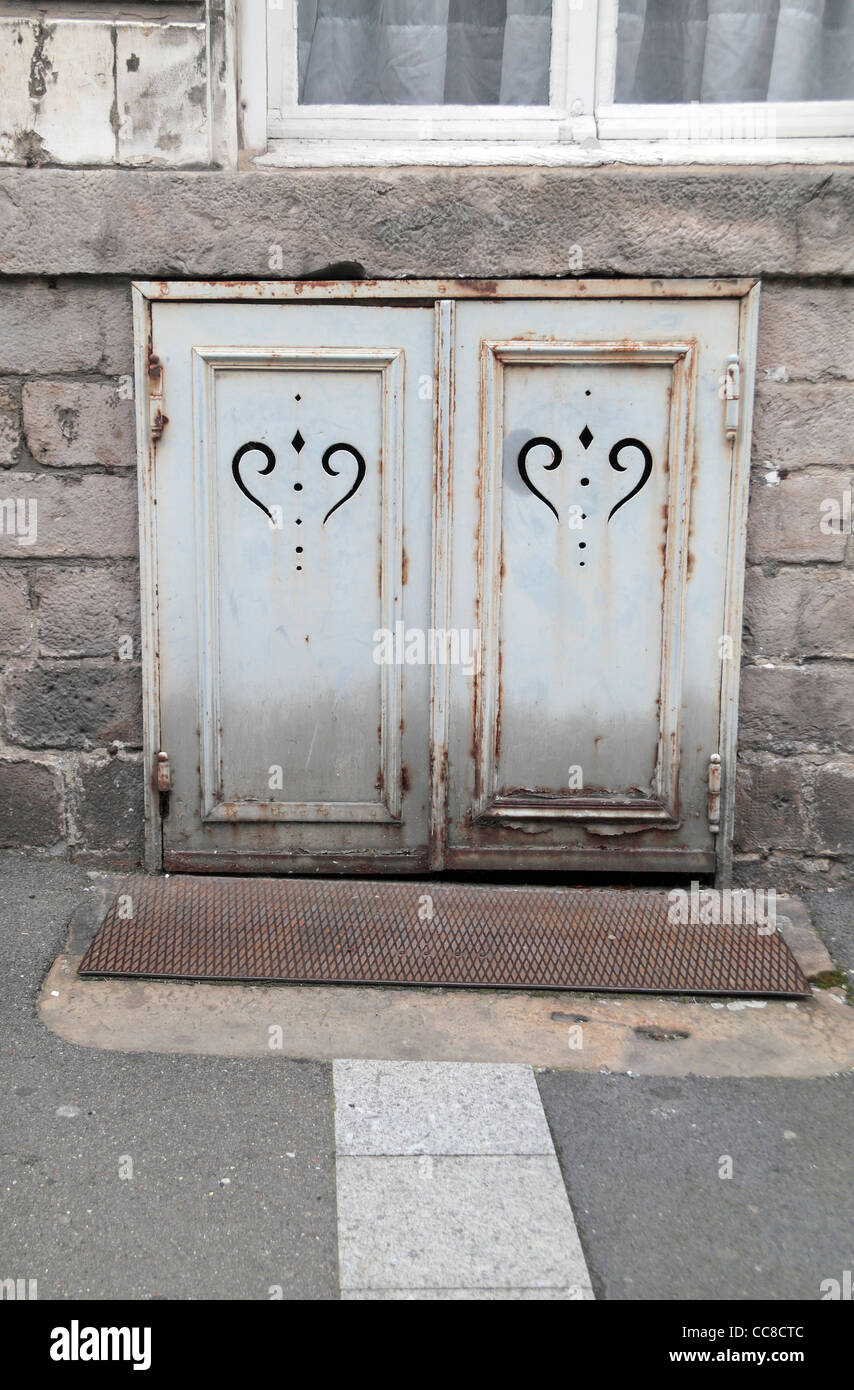 Street level doors leading to a property basement on a street in Arras, Pas-de-Calais, France. Stock Photo