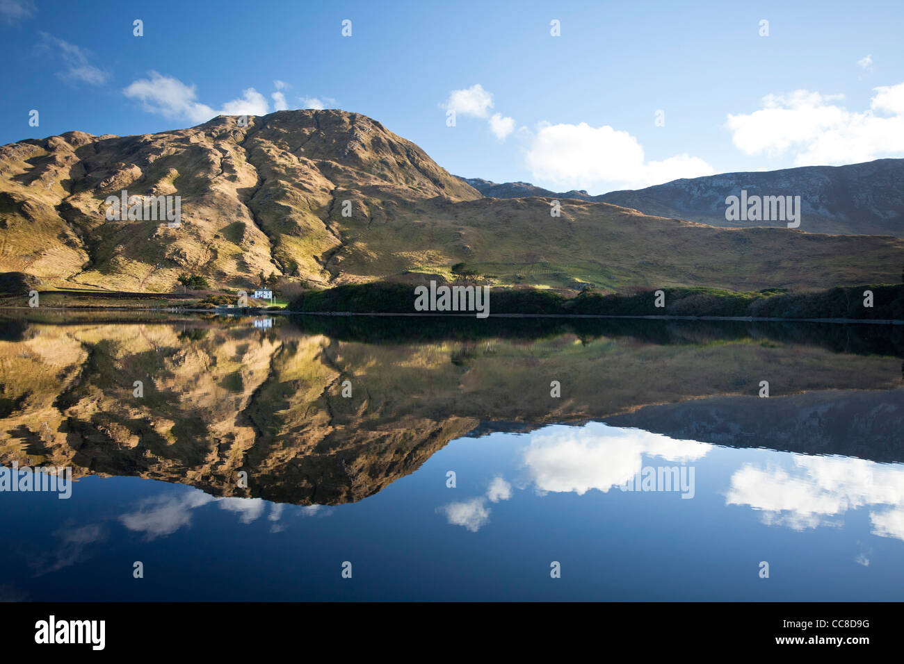 Evening reflection of the Twelve Bens Mountains in Kylemore Lough, Connemara, County Galway, Ireland. Stock Photo